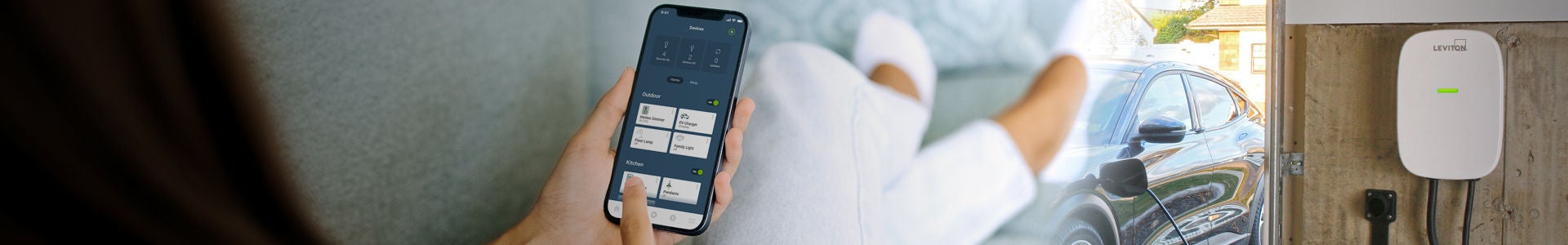 Woman Engaging My Leviton App to check on Charging Status of her EV